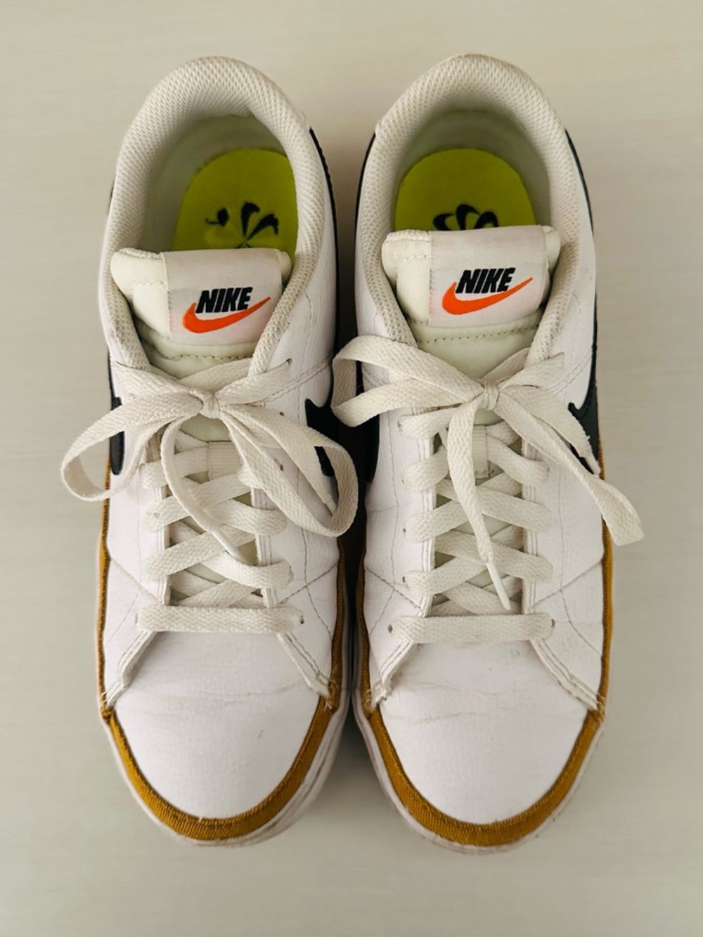 Nike White Black Low-Top Sneakers with Gold Accent